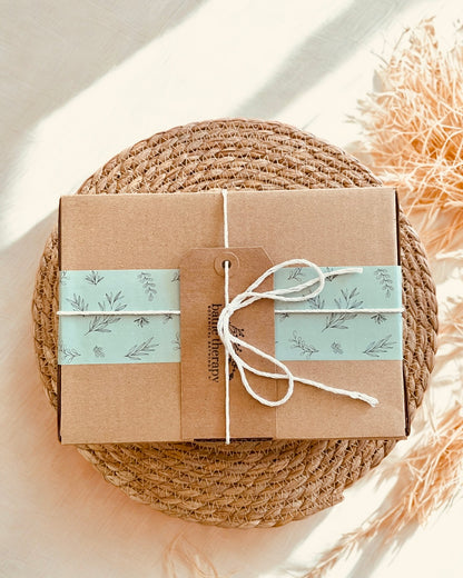Gift box wrapped in sustainable box with a handwritten gift 